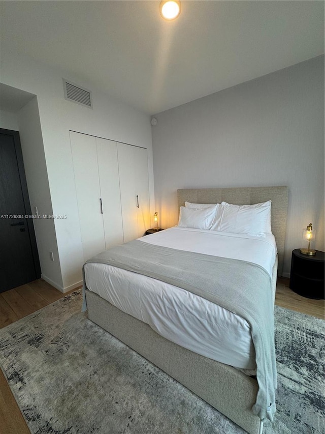 bedroom featuring a closet and hardwood / wood-style floors