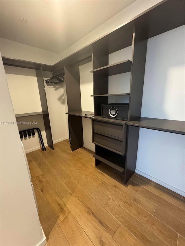 walk in closet featuring light wood-type flooring