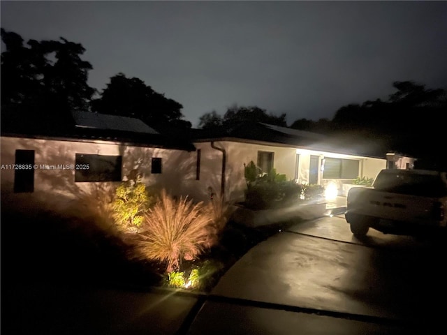 view of property exterior at twilight