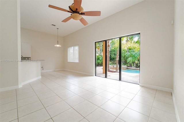 spare room featuring ceiling fan and light tile patterned floors