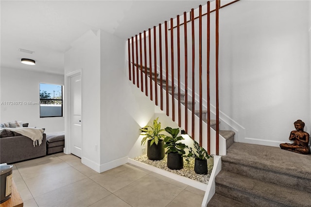 staircase with tile patterned flooring