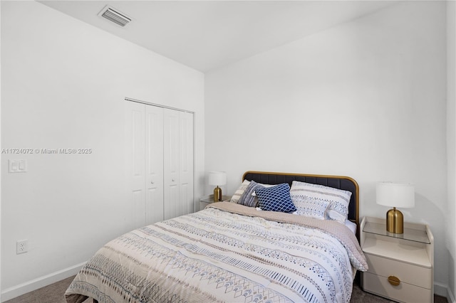 bedroom with carpet floors and a closet