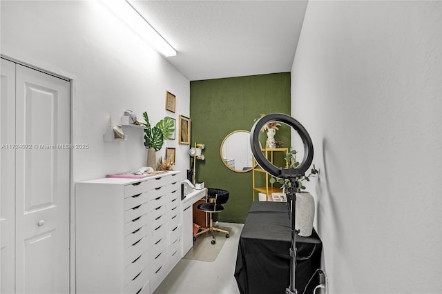 home office featuring a textured ceiling