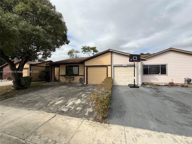 view of front of home featuring a garage and driveway