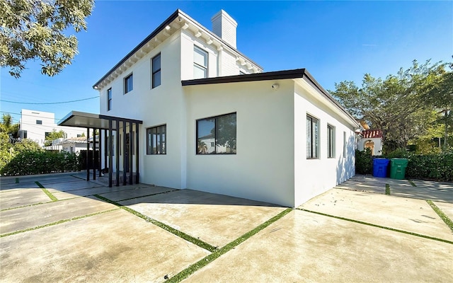 view of home's exterior with a patio area