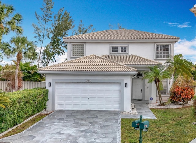 mediterranean / spanish-style home with a garage