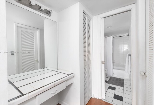345 Ocean Dr Unit 304, Miami Beach, FL 33139 - bathroom featuring a closet and shower / bathtub combination with curtain
