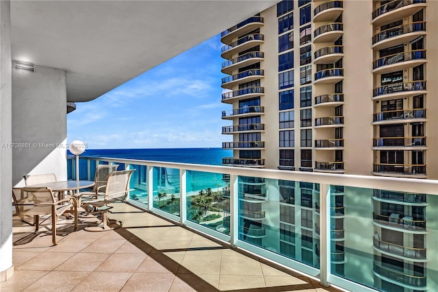 balcony featuring a water view