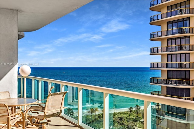 balcony featuring a water view