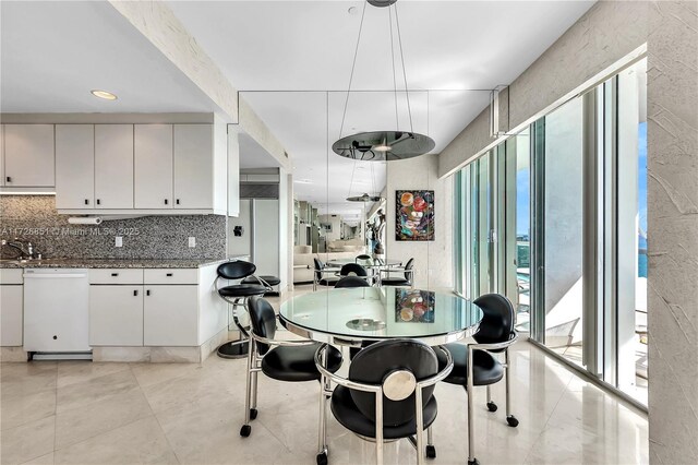 dining area with a healthy amount of sunlight and sink