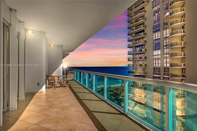 balcony at dusk with a water view