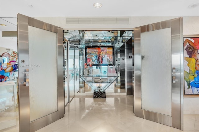 hallway with light tile patterned flooring