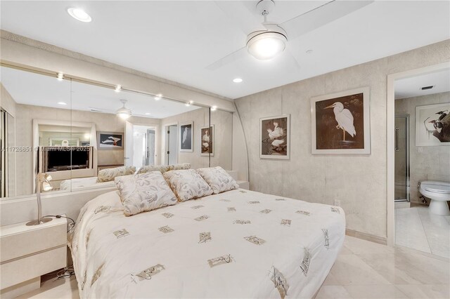 bedroom featuring connected bathroom and ceiling fan