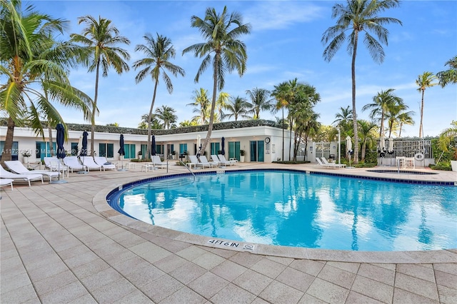 view of swimming pool with a patio area