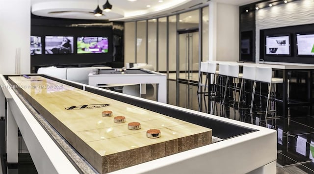 recreation room featuring dark tile patterned flooring