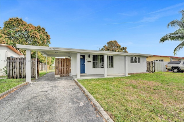 ranch-style home with a front yard