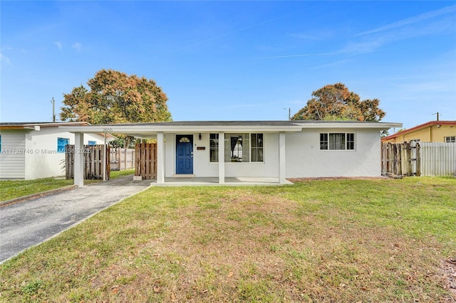 ranch-style home featuring a front yard