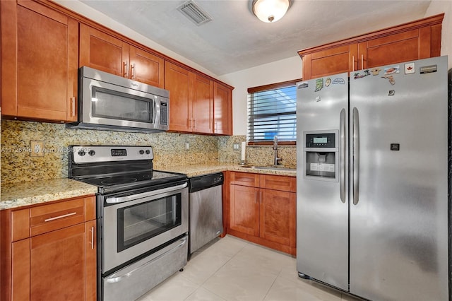 tiled dining area with washer and dryer and ceiling fan