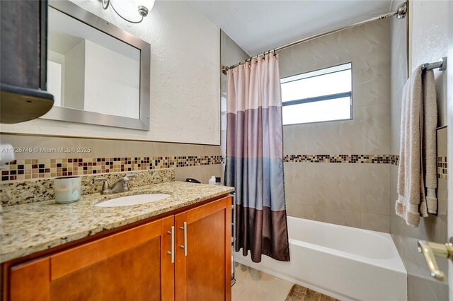 washroom featuring cabinets, light tile patterned floors, electric panel, and independent washer and dryer