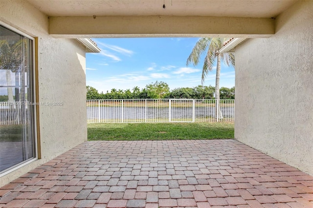 view of patio featuring a water view