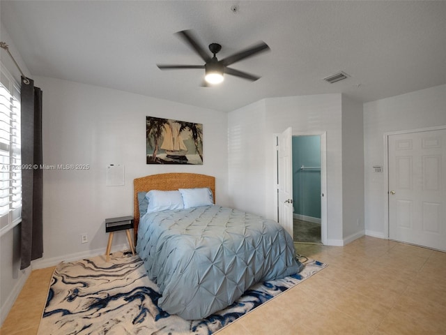 bedroom featuring a walk in closet, ceiling fan, and a closet