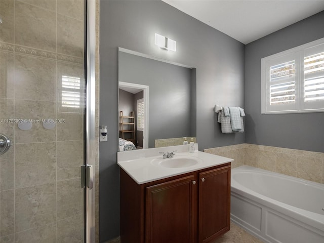 bathroom featuring vanity and plus walk in shower