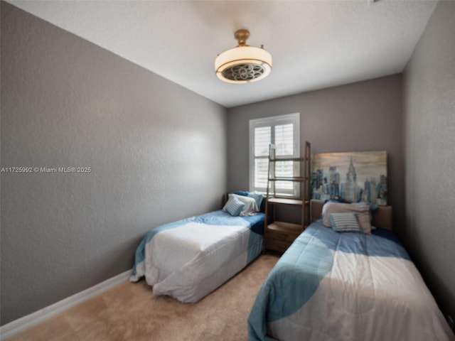 bedroom featuring light carpet