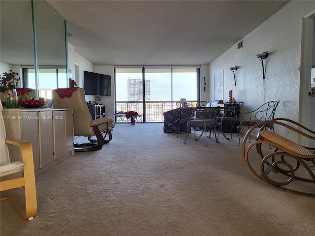 interior space featuring carpet floors and floor to ceiling windows