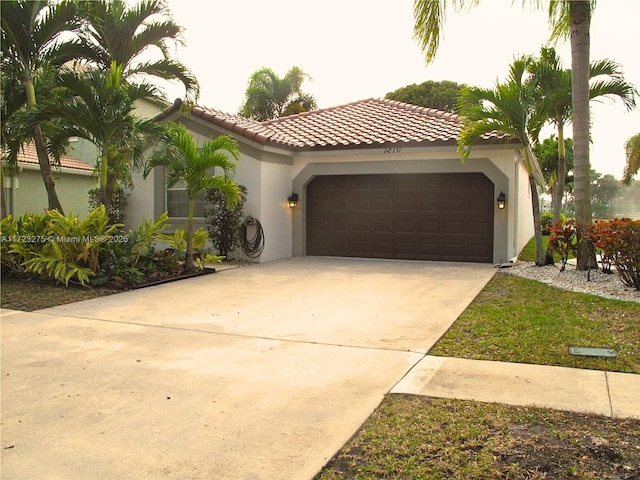 mediterranean / spanish home with a garage