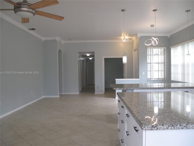 kitchen with ceiling fan, pendant lighting, white cabinets, and light stone countertops