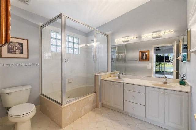 full bath featuring toilet, a sink, and plenty of natural light