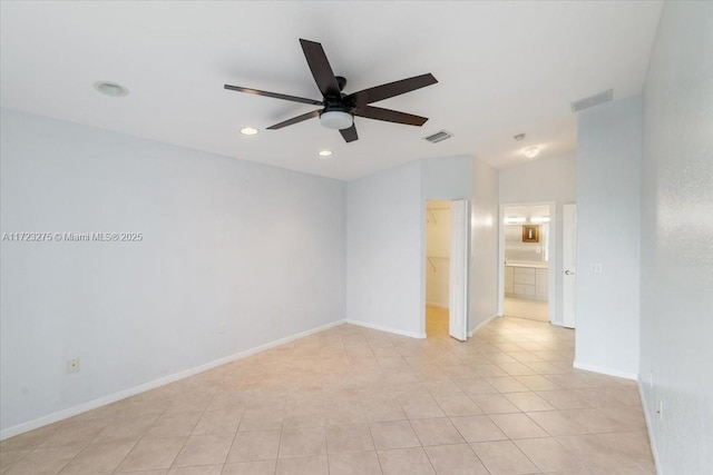 spare room featuring visible vents, baseboards, light tile patterned floors, a ceiling fan, and recessed lighting