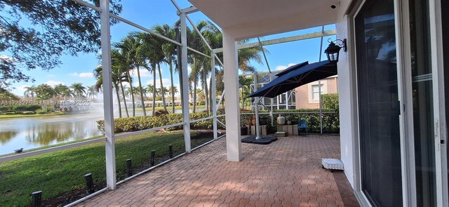 view of yard featuring glass enclosure and central air condition unit