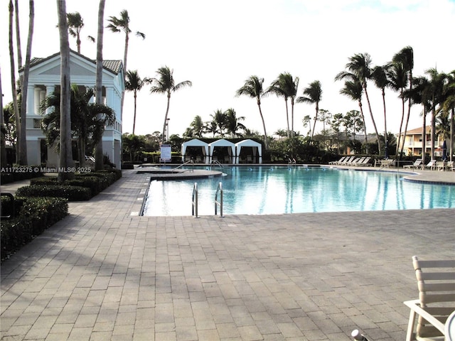 view of swimming pool with a patio