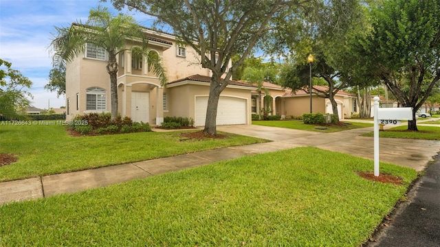 mediterranean / spanish home with a front lawn and a garage