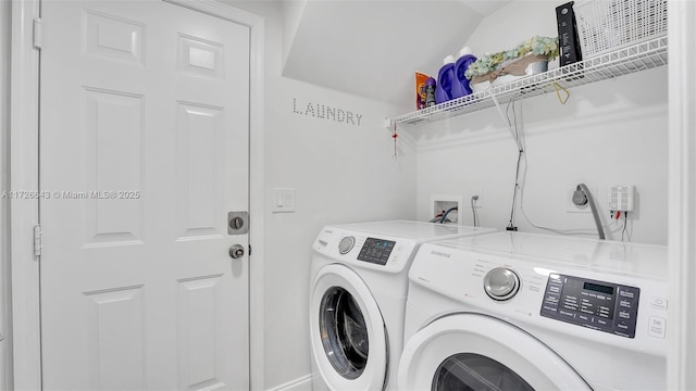 washroom with washing machine and dryer