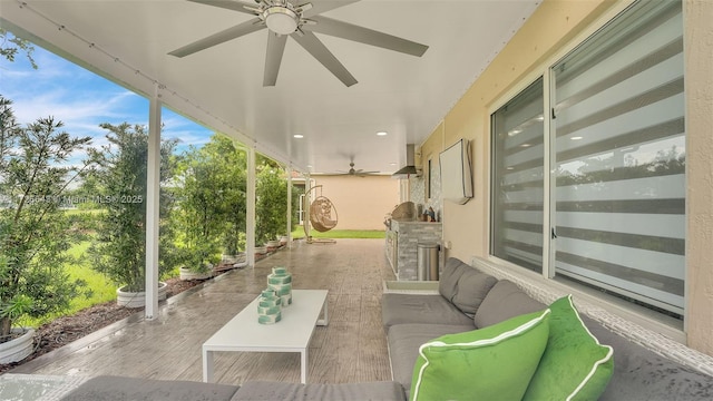 view of patio / terrace featuring ceiling fan and an outdoor living space