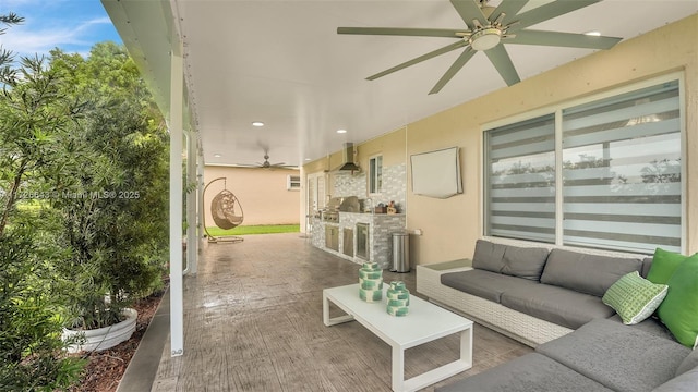 view of patio with an outdoor hangout area, ceiling fan, and exterior kitchen