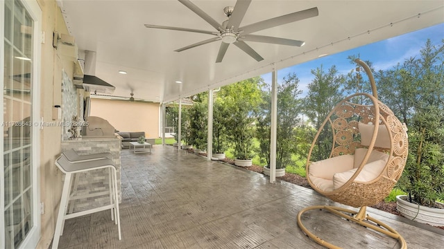 view of patio / terrace featuring an outdoor kitchen and a grill