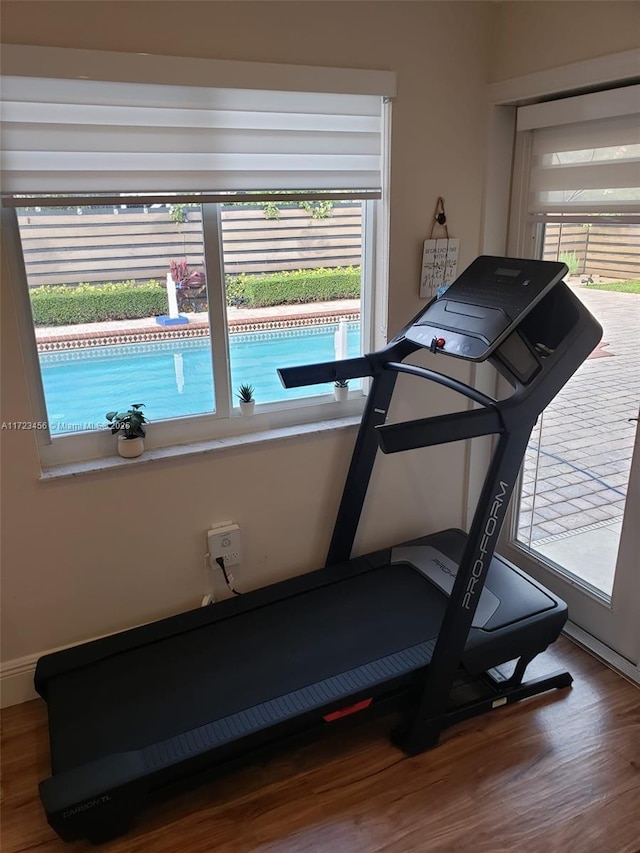 exercise area featuring hardwood / wood-style flooring