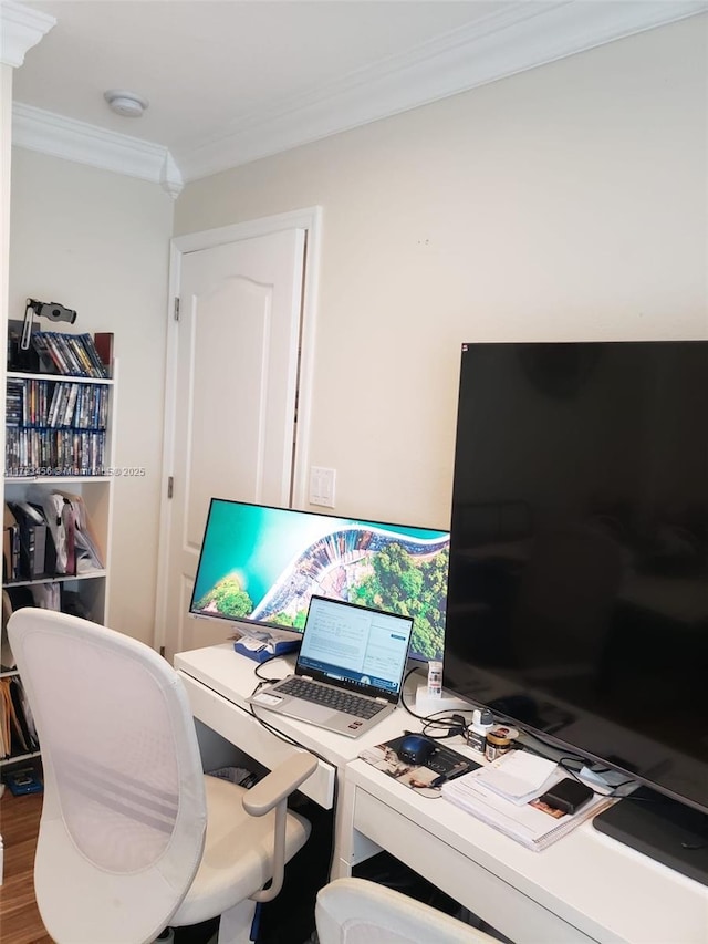 home office with hardwood / wood-style flooring and crown molding