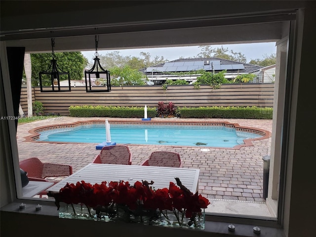 view of swimming pool featuring a patio