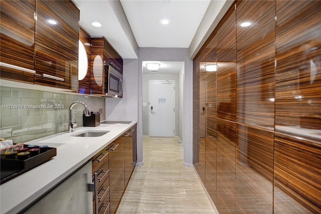 kitchen featuring backsplash and sink