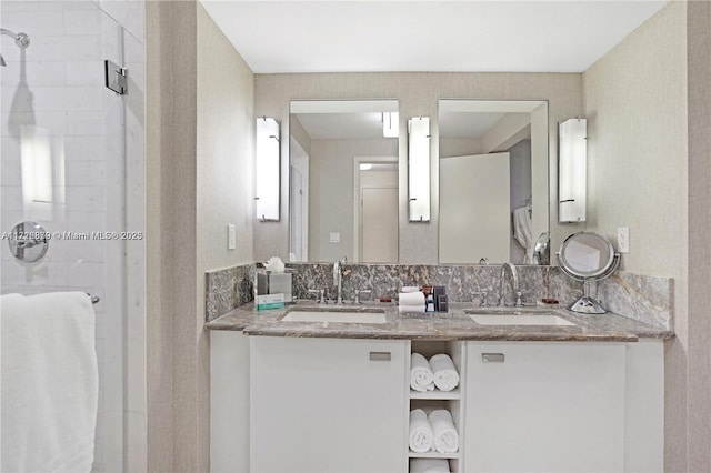 bathroom featuring an enclosed shower and vanity