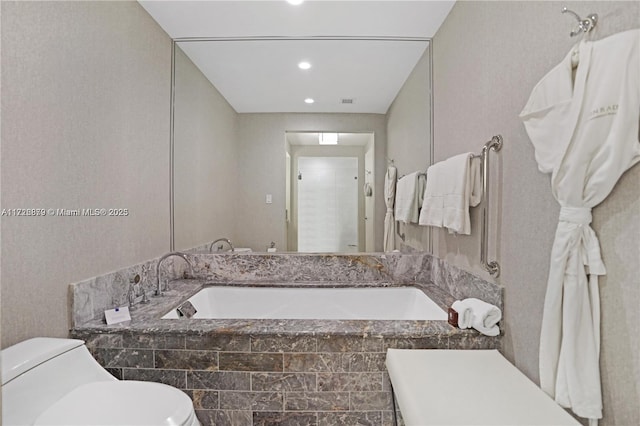 bathroom with toilet and walk in shower