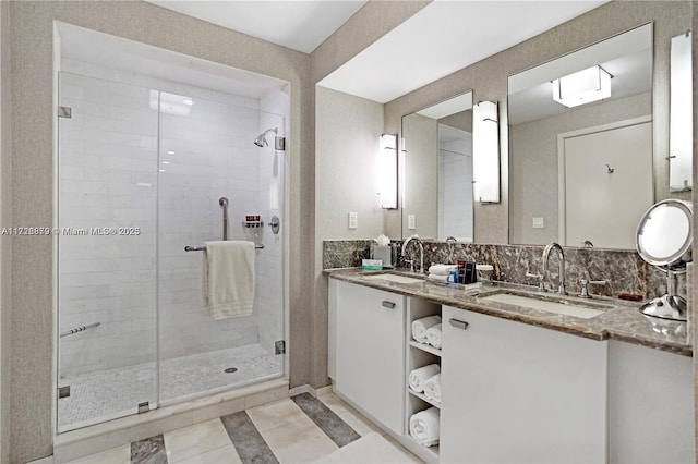 bathroom with backsplash, tile patterned floors, vanity, and an enclosed shower