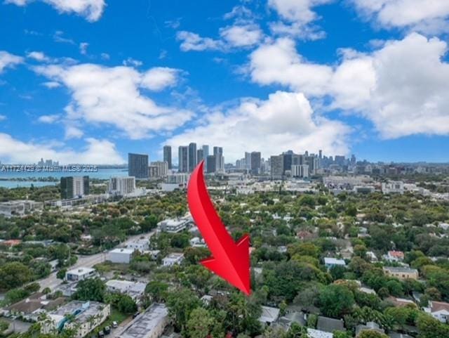 drone / aerial view with a view of city and a water view