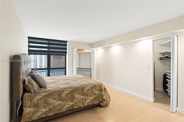 bedroom featuring light wood-type flooring