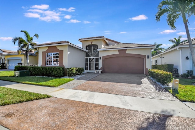 view of front of property with a garage and a front yard