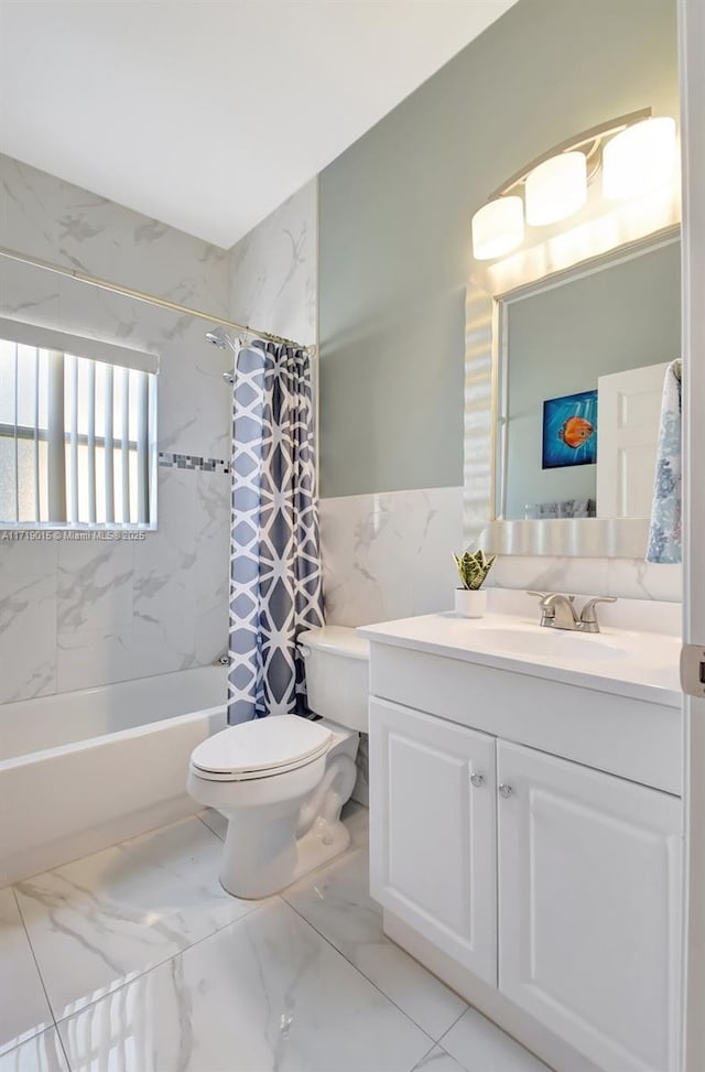 full bathroom with shower / bath combo, tile walls, vanity, and toilet